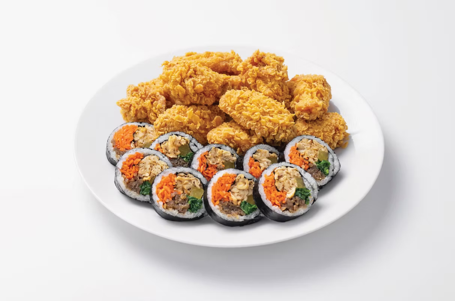 Spicy tteokbokki rice cakes in red sauce with vegetables